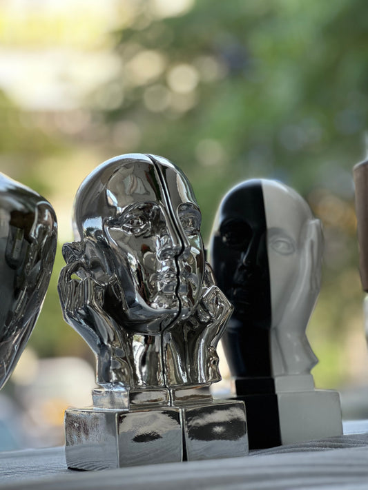 Silver sculpture book holder